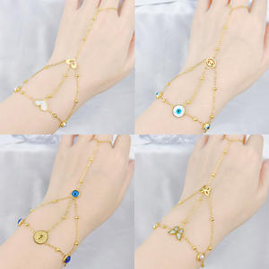 Bracelet chaîne en acier inoxydable avec pendentif œil bleu, chaîne de doigt, chaîne de poignet, forme de squelette, motif floral - Product Image 4