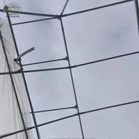 Système de fenêtres papillon pour serres, pour la ventilation des serres
