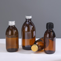Bouteilles en verre pharmaceutiques de sirop de toux maigre rond de balle ambre de 30 60 100 125 250 300 ml avec le chapeau de Ropp de 28 mm