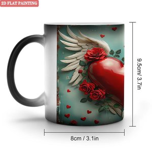 Taza Mágica de Cerámica Negra Esmerilada de 11 oz que Cambia de Color con Diseño de Alas de Corazón - Product Image 1
