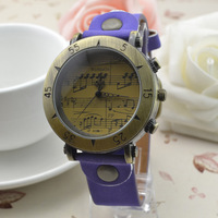 Womage-568-1 Montre rétro Womage avec boîtier en alliage, mouvement à quartz, bracelet en cuir, style punk, motif note de musique, vente en gros disponible