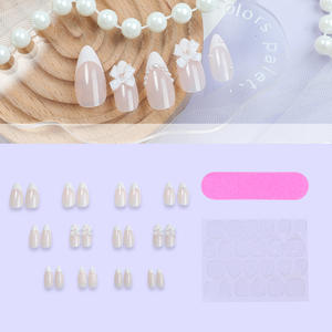 <span class=keywords><strong>Uñas</strong></span> postizas con lazo blanco perla francesa estilo Ins, <span class=keywords><strong>Uñas</strong></span> postizas de <span class=keywords><strong>color</strong></span> <span class=keywords><strong>carne</strong></span> puntiagudas en forma de gota de agua desnuda para dedos de plástico - Product Image 1