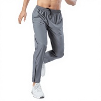 Nouveau pantalon de jogging léger et décontracté en polyester/nylon à séchage rapide avec fermeture éclair et cordon de serrage pour homme, idéal pour la course et la gym