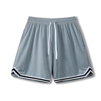 Shorts de sport pour hommes et enfants, tissu polyester, coupe ample, séchage rapide. Idéal pour le football, la course à pied et l'entraînement physique.