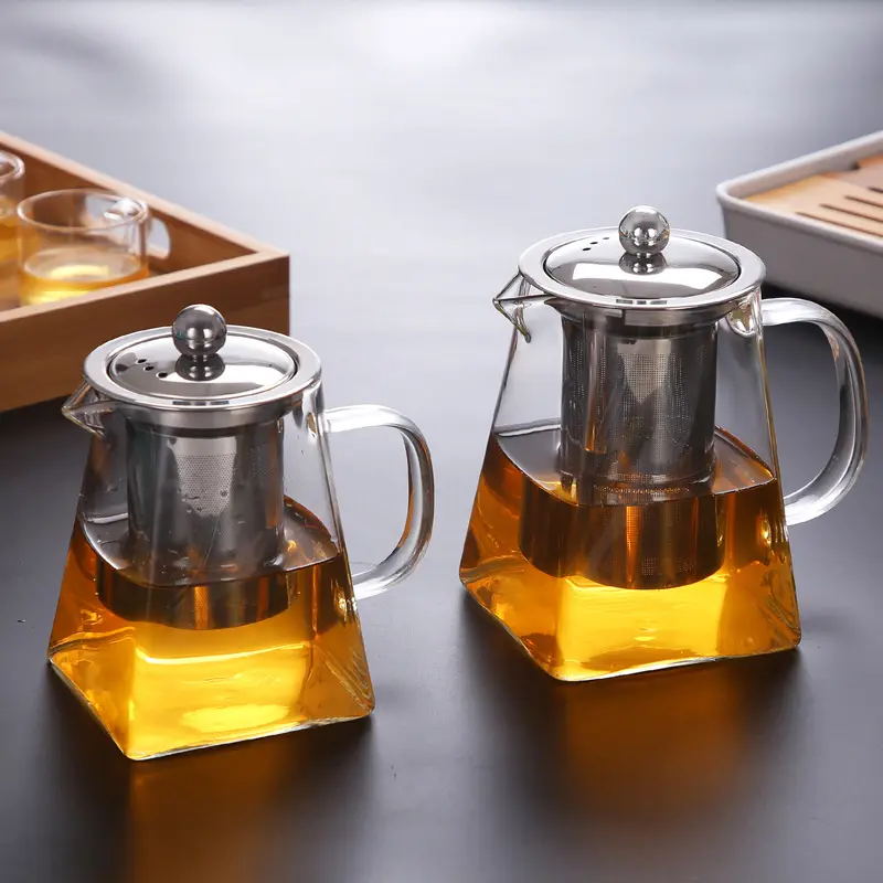 Grosir panci teh kaca borosilikat tahan panas tinggi unik Tiongkok dengan pegangan