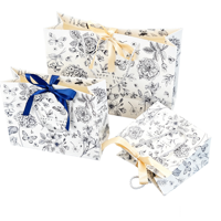 Sac cadeau personnalisé en papier blanc avec poignées en cordon tressé et imprimé floral en ligne pour l'emballage de vente au détail d'accessoires OEM