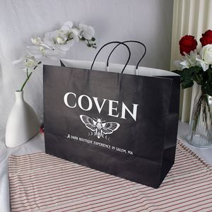 Custom Logo Ribbon Handle Black Coated Paper Bag Embossing for Fashion Apparel Brands Paper Shopping Bags with Hot Foil - Product Image 1
