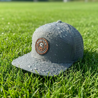 Casquette de baseball haute performance à 7 panneaux, imperméable, avec patch en caoutchouc personnalisé découpé au laser, coutures exquises