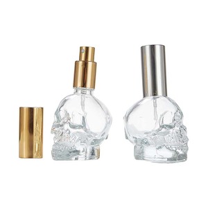 عرض خاص زجاجة عطر زجاجية على شكل جمجمة ، بخاخ قابل لإعادة الملء بغطاء ذهبي/فضي - Product Image 1