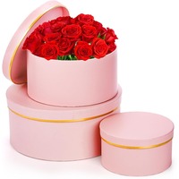 Boîte cadeau ronde avec couvercle, présentant un motif floral rose avec bordure dorée, personnalisable selon vos besoins