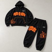 Ensemble sweat à capuche et jogging noir personnalisé pour homme avec imprimé contrastant orange et cordon de serrage, style streetwear OEM ODM