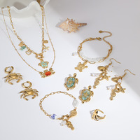 Ensemble de bijoux en acier inoxydable plaqué or 18 carats PVD pour femmes, comprenant un collier, des boucles d'oreilles et un bracelet avec pendentifs tortue de mer, crabe, hippocampe, coquillage et étoile de mer