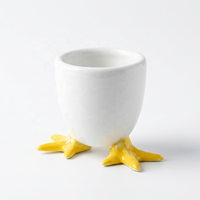 Vente en gros d'œufières créatives en céramique blanche en forme de pattes de canard, porte-œufs amusants en porcelaine en forme d'animaux pour la cuisine, le petit-déjeuner, la décoration de Pâques