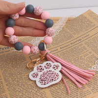Cadeau pour la fête des mères, porte-clés en silicone à motif léopard avec pompon, breloques mignonnes en forme de patte de chien, bracelet porte-clés, porte-clés de voiture