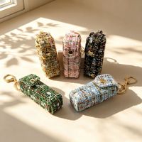 Pochette de rangement vintage de luxe en tweed pour rouge à lèvres, avec empiècements en cuir, breloque de sac porte-clés, décor transfrontalier pour cadeau promotionnel