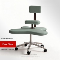 Chaise de sol robuste au design moderne et minimaliste, avec assise rembourrée et roulettes, idéale pour poser les jambes