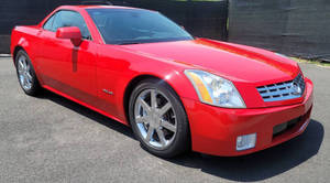 2007 XLR Passion Red รถเปิดประทุน 2 ประตู พวงมาลัยซ้าย เบาะหนัง ระบบวิทยุพร้อมจอแสดงผล ซันรูฟ ไฟท้าย LED - Product Image 5