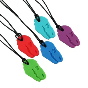 Nouveau vente chaude anti-manger main mâcher formation silicone souple bébé enfants dinosaure tête gomme molaires anneau de dentition gouvernail mâcher jouet anneau