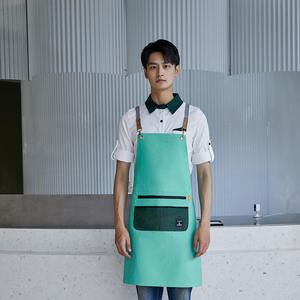 Delantal de poliéster impermeable color verde guisante con correas para los hombros para uso en restaurantes y bares - Product Image 1