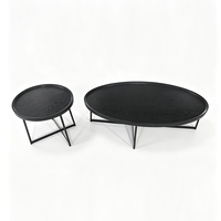 Ensemble de tables basses ovales modernes noires avec plateau en bois grainé et pieds en métal pour salon