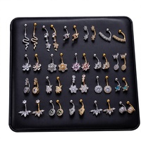 Produit transfrontalier très vendu : Piercing de nombril pour femme avec zircon coloré, pampille, trèfle à quatre feuilles et motif dauphin mignon