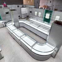 Sundo : Agencement clé en main pour bijouterie, comptoir d'exposition incurvé, vitrine en verre, fabricant d'aménagements intérieurs pour bijouteries