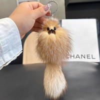Porte-clés queue de renard véritable mignon avec nœud papillon, pendentif animal doux et moelleux pour la décoration de sacs et accessoires féminins