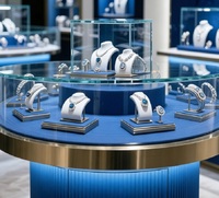 Vitrine à bijoux circulaire double couche GZowin de luxe bleue et dorée avec éclairage LED, design personnalisable, en verre