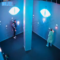 Jeu de construction d'équipe populaire jeu de mur LED amusant intérieur interactif cachant la salle d'activation les yeux du diable cacher activer le jeu pour les états-unis