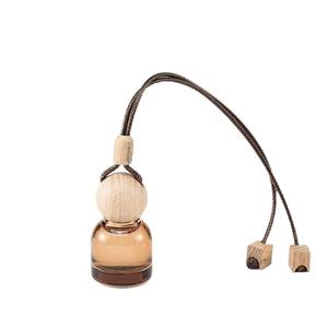 บรรจุภัณฑ์รักษ์โลก ขวดแก้วน้ำหอมปรับอากาศในรถยนต์ขนาด 8 มล. สีน้ำตาล พร้อมฝาไม้ - Product Image 1