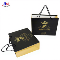 Sac en papier noir réutilisable de luxe avec poignée pour emballage de vêtements, cadeaux et achats professionnels, personnalisable et durable