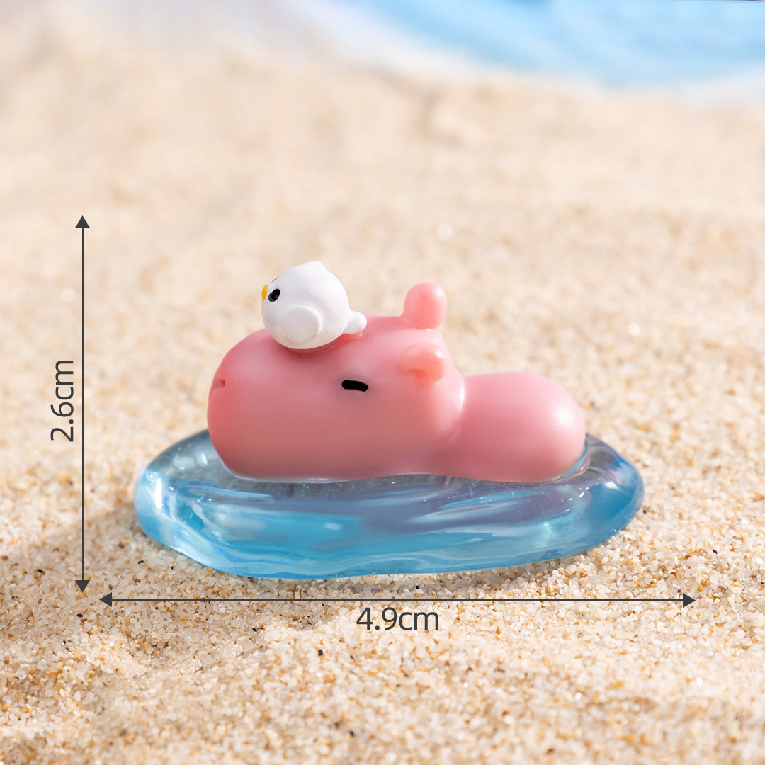 11 # Capybara rose de natation