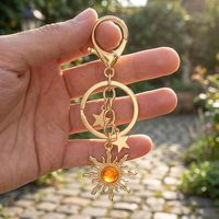 Porte-clés pendentif unisexe en alliage de zinc, motif étoile et soleil ajouré, électroplaqué, accessoire de sac et de bagage, style mode
