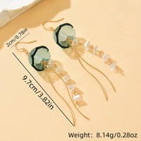 Boucles d'oreilles tendance en perles de verre oniriques avec créatures marines fluides et motifs pastèque