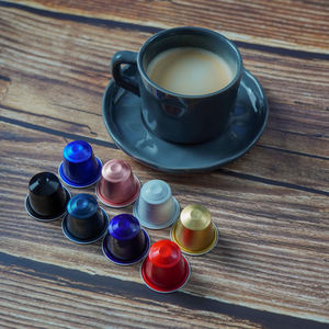 Cápsulas de café de papel de aluminio específicas para máquinas de café desechables de alta calidad con características comerciales que incluyen anillos de goma con tapa - Product Image 1