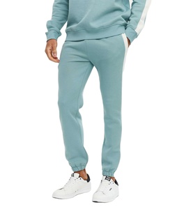 Pantalon de jogging bleu à rayures latérales pour homme Mélange doux de coton et d'élasthanne avec tissu anti-rides et poches Service OEM - Product Image 1