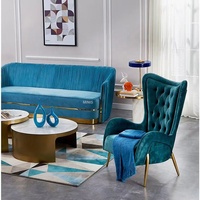 Fauteuil de visiteur moderne et élégant en velours bleu, léger et rembourré, à dossier haut, de luxe discret, pour la maison, le bureau ou la chambre.