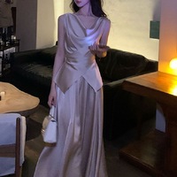 Ensemble jupe taille haute amincissante et débardeur sans manches de style français, luxe léger et tendance pour femme, Nouvelle collection 2026