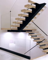Escalier flottant sur mesure à poutre unique pour villa, avec balustrade en verre trempé