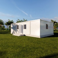 Maison conteneur de luxe préfabriquée démontable de 40 pieds, type flat pack, modulaire, avec 2 chambres, cuisine et séjour.