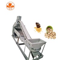 Machine à écraser, à casser et à décortiquer les pistaches et les pignons de pin