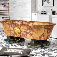 Baignoire autoportante ovale en marbre jaune ocre avec piédestal en forme de tête de lion dorée, luxe pour hôtel et jardin