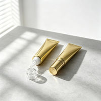 Tube cosmétique brillant doré avec bouchon à vis, impression sérigraphique, contenant vide compressible pour baume à lèvres, kit de voyage