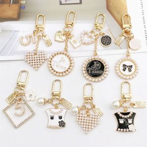 Diamond Keychain Perfume Bottle Bow Pearl Keychain Women Diy Bling Key Chains <b>Bag</b> Pendant Phone Charm Car KeyRing Heart Keychain - Product Image 1