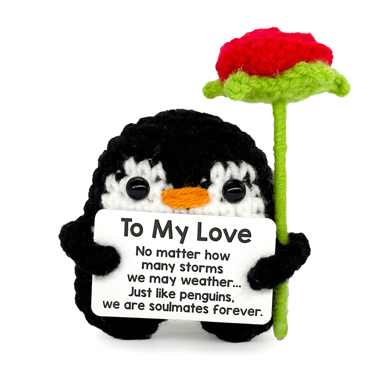 Pingouin à pattes ouvertes tenant une rose