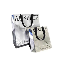 Sacs de shopping en papier d'art doré argenté portables avec logo personnalisé Impression naturelle Sacs de vente au détail réutilisables