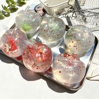 Balle anti-stress en TPR façon pomme de Noël, à base d'huile de coco, compressible, non-réalimentable, faite à la main, en boîte colorée, vente en gros