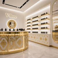 Vitrine de présentation de parfums sur mesure avec cadre doré, éclairage LED, comptoir îlot rond pour boutique de cosmétiques et de parfums