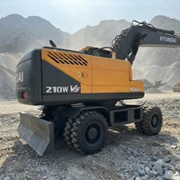 Excavatrice sur pneus Hyundai 210-9 d'occasion, modèle 21 tonnes, moteur Cummins 124KW, capacité de la benne 0,51-1,34m, boîte de vitesses, vente Shanghai