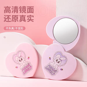 Lmltop Juego de espejo y peine con forma de corazón, mini espejo de maquillaje portátil de viaje con diseño giratorio para uso diario - Product Image 1